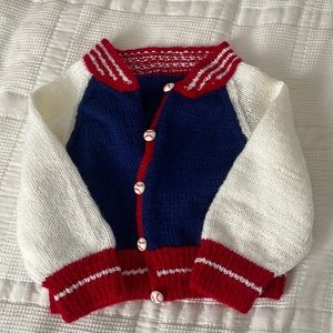 Hand knit baseball baby sweater jacket. Fits approximately 6 months to 12 months
